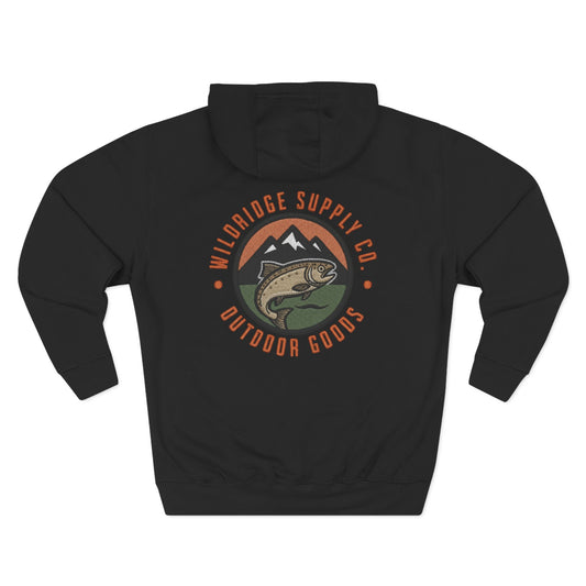 Black hoodie showcasing a large circular patch-style graphic on the back (trout jumping in front of mountains and pine trees