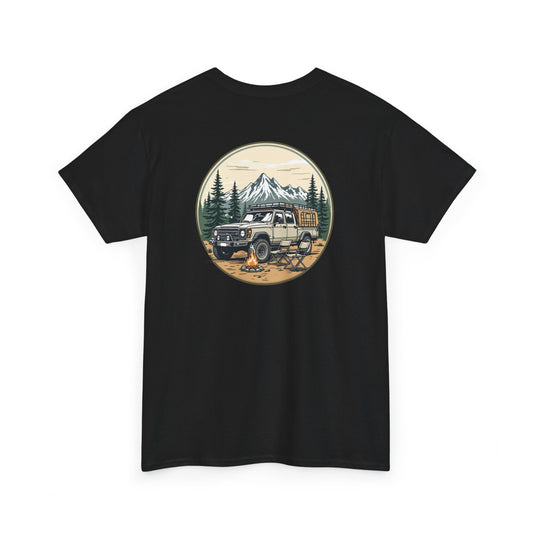 Black unisex t-shirt featuring a vintage badge graphic of a 4x4 SUV, campfire, pine forest, and snowcapped mountains.