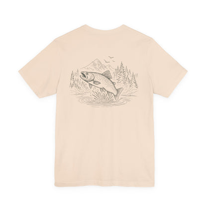 Beige t-shirt with a graphic of a fish and nature scene on the back, on a white background.