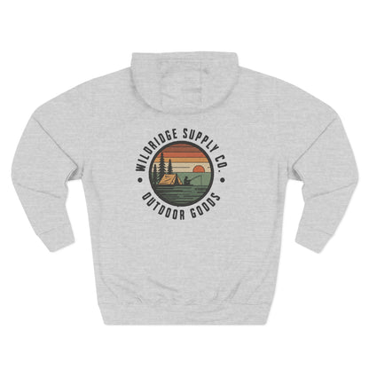 Back view—Wildridge Supply Co Outdoor Goods camp badge on heather gray hoodie