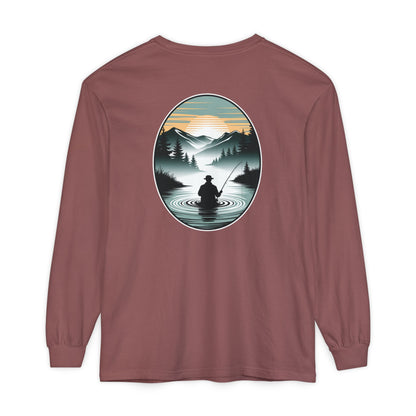Long-sleeve shirt with a nature-themed graphic on the back, featuring a person fishing in a lake with mountains in the background.