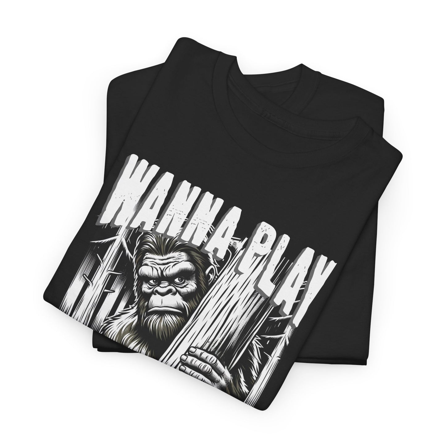Black t-shirt with creepy Bigfoot design peeking from behind a tree and bold text that reads ‘Wanna Play’ – horror cryptid graphic shirt