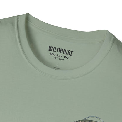 Close-up of a green t-shirt with 'Wildridge Supply Co.' branding on a white background
